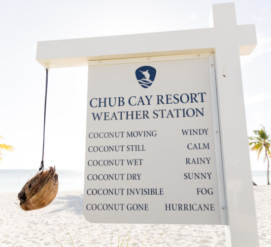 Sunny day at Chub Cay Resort, captured near the weather station with clear skies and calm waters.