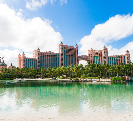 Tranquil beach view with crystal-clear waters and soft sands in Nassau Bahamas.