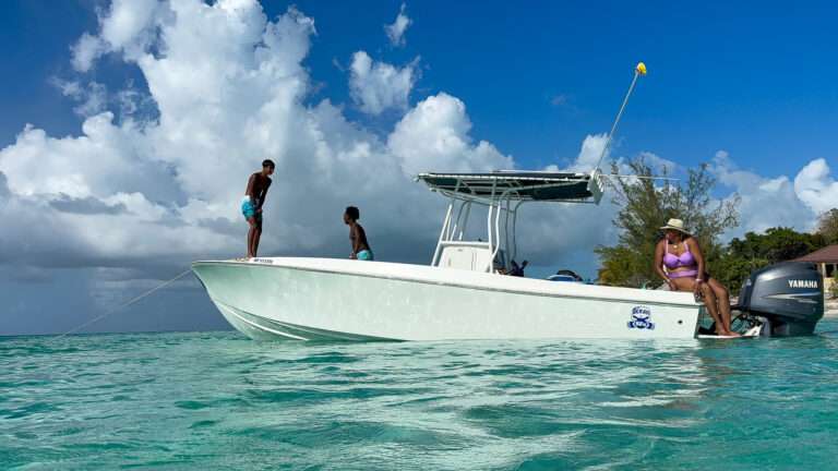 Family enjoying a private boat charter in Nassau, Bahamas with time to swim and relax at their own pace.