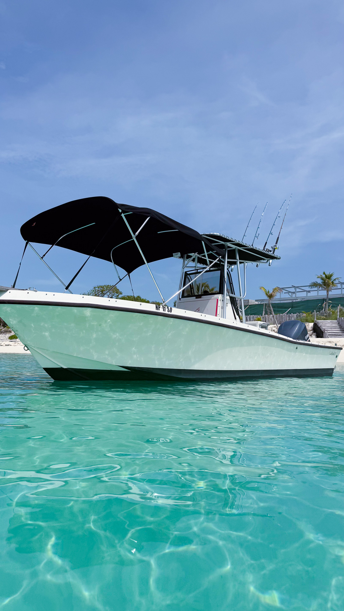 Forever the Co anchored in the turquoise waters near Rose Island, Bahamas.